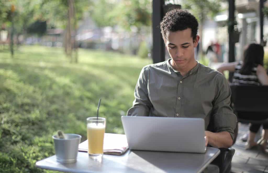 What is Microsoft Intune? Man using laptop outside